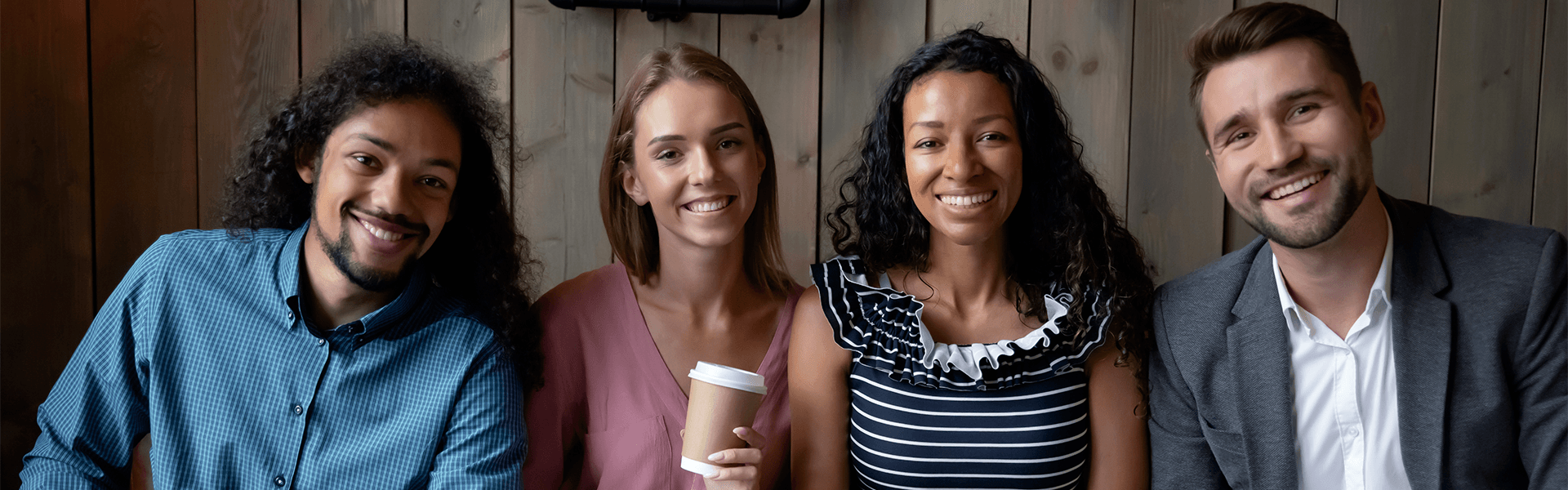 three female students working at a computer together